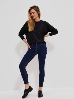 Granatowe spodnie damskie jeansowe rurki z dżetami Moodo