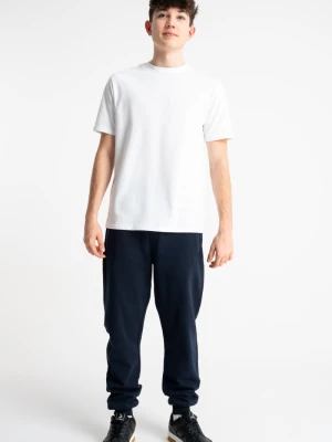 Granatowe spodnie dresowe SLIM z minimalistycznym nadrukiem Reporter