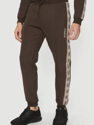 GUESS Brązowe męskie spodnie dresowe z lampasami Mickey, Rozmiar L