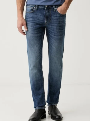 Guess jeansy slim taper męskie FINNLEY granatowy