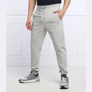 Zdjęcie produktu GUESS Spodnie dresowe Adam | Relaxed fit