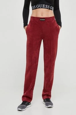 Guess spodnie dresowe kolor czerwony gładkie