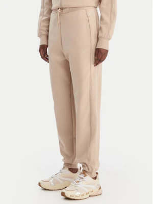 Guess Spodnie dresowe V5BB23 KCX22 Beżowy Regular Fit