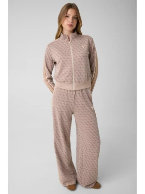 Guess Spodnie dresowe V6YB27 K5181 Beżowy Relaxed Fit