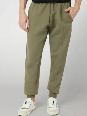 GUESS Zielone męskie spodnie dresowe z lampasami Mickey, Rozmiar M