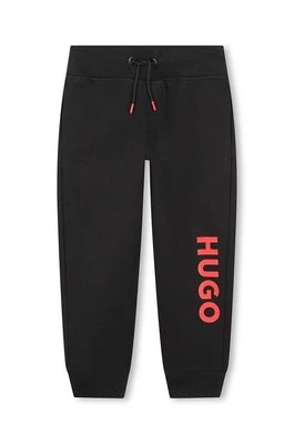 HUGO spodnie dresowe dziecięce kolor czarny z nadrukiem