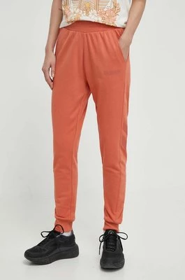 Hummel spodnie dresowe hmlLEGACY WOMAN TAPERED PANTS kolor pomarańczowy z nadrukiem 212564