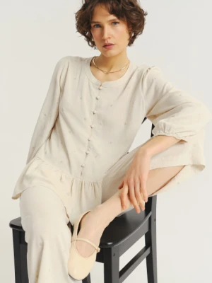 Jasnobeżowa bluzka z ozdobną falbanką u dołu Greenpoint