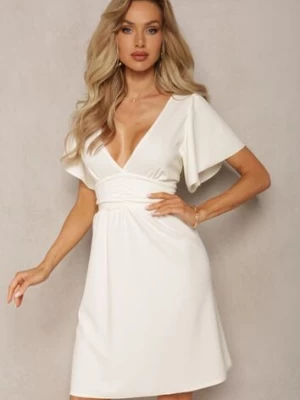 Jasnobeżowa Sukienka z Rozkloszowanym Dołem i Ozdobnymi Przeszyciami Celarsa new collection