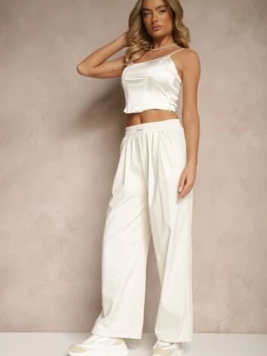 Jasnobeżowe Spodnie o Szerokim Kroju z Bawełną High Waist Ozdobione Naszywką Naneriela alina