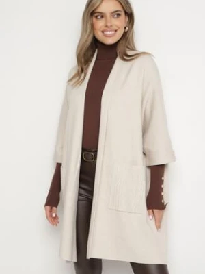 Jasnobeżowy Niezapinany Kardigan z Kieszeniami i Ozdobnymi Guzikami Sinellia glo-story