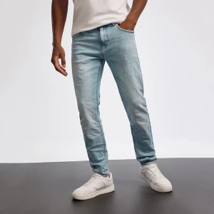 Jasnoniebieskie jeansy slim fit z efektem sprania House