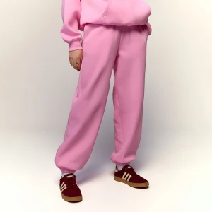 Jasnoróżowe spodnie dresowe jogger House