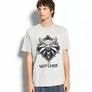 Zdjęcie produktu Jasnoszara koszulka z nadrukiem The Witcher House