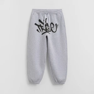 Jasnoszare spodnie dresowe baggy z nadrukiem w stylu graffiti House