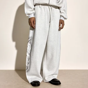 Jasnoszare spodnie dresowe super baggy z moywem tribal House jasnoszary