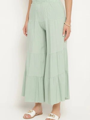 Jasnozielone Szerokie Spodnie z Wiskozy z Gumką w Talii Ozdobione Falbanką Dimlea Cflo Zielony