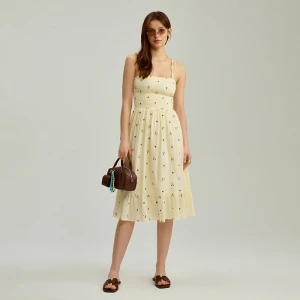 Jasnożółta sukienka midi w kwiaty na ramiączkach House