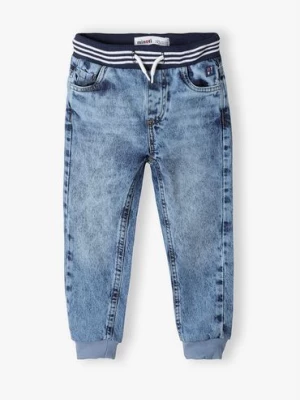 Jeansowe spodnie dla niemowlaka z wiązaniem Minoti