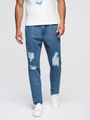 Jeansowe spodnie męskie CARROT FIT z przetarciami – niebieskie V2 - Rozmiar: M Ombre Clothing