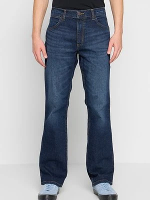 Jeansy Bootcut Wrangler pomarańczowy