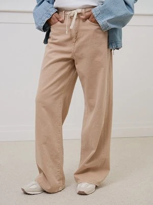 Jeansy loose fit GAP beżowy