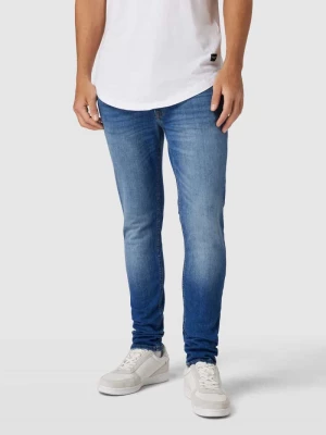 Jeansy o kroju skinny fit z wpuszczanymi kieszeniami model ‘LIAM’ jack & jones