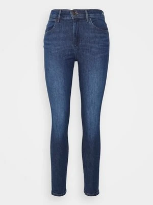 Jeansy Skinny Fit Wrangler ciemnoniebieski