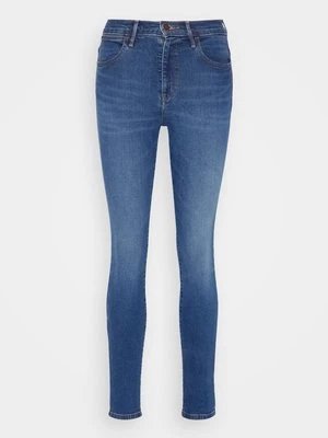 Jeansy Skinny Fit Wrangler ciemnoniebieski