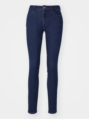 Jeansy Skinny Fit Wrangler ciemnoniebieski