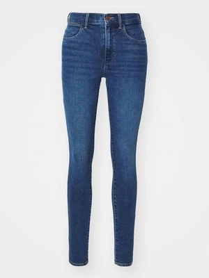 Jeansy Skinny Fit Wrangler ciemnoniebieski