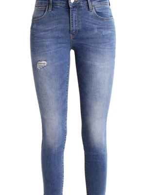 Jeansy Skinny Fit Wrangler przecierany denim