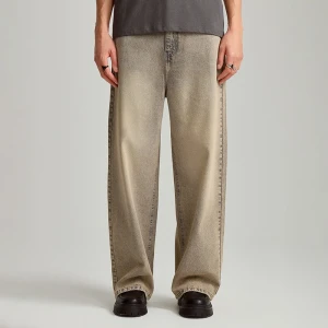 Zdjęcie produktu Jeansy super baggy fit z efektem sandwash beżowo-niebieskie House