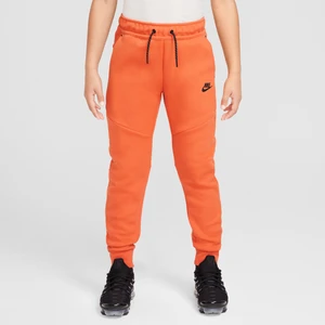 Joggery dla dużych dzieci Nike Sportswear Tech Fleece - Pomarańczowy