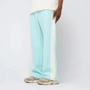 Karl Kani Sidestripe Trackpants mężczyźni Spodnie dresowe turkusowy rozmiar Odzież