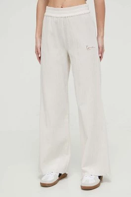 Karl Kani spodnie bawełniane kolor beżowy szerokie high waist