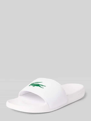 Klapki basenowe z nadruk z logo model 'SERVE SLIDE' Lacoste Biały