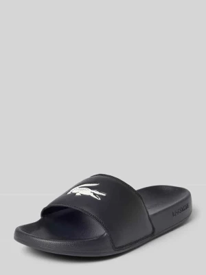 Klapki basenowe z nadruk z logo model 'SERVE SLIDE' Lacoste Czarny