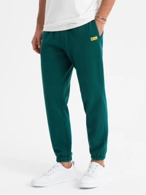 Klasyczne dresowe spodnie unisex ze ściągaczami – ciemnozielone V17 OU-PSBC-0100
 -                                    M/L Ombre