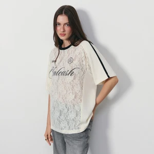 Koronkowa kremowa koszulka z nadrukiem Unleash House