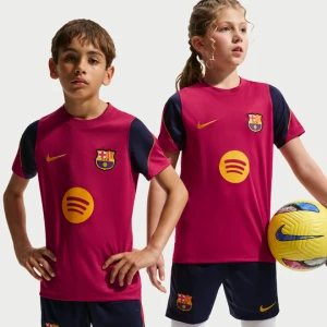 Koszulka piłkarska z krótkim rękawem dla dużych dzieci Nike Dri-FIT FC Barcelona Strike - Czerwony