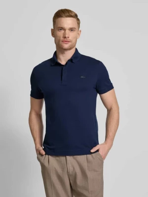 Koszulka polo o kroju regular fit z naszywką z logo model ‘CORE PIQUE’ Lacoste