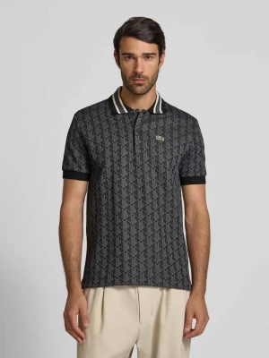 Koszulka polo o kroju regular fit ze wzorem na całej powierzchni Lacoste