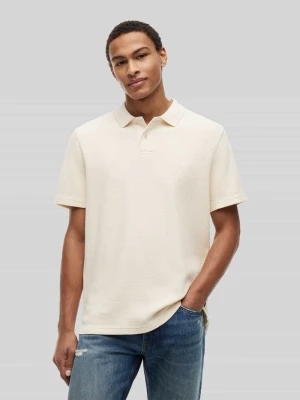 Koszulka polo o kroju relaxed fit z czystej bawełny Tommy Jeans Piaskowy