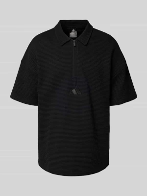 Koszulka polo o kroju relaxed fit z wyhaftowanym logo adidas Sportswear