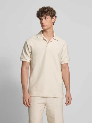 Koszulka polo o kroju relaxed fit z wyhaftowanym logo Puma Złamany biały