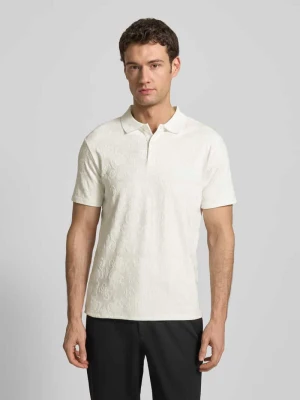 Koszulka polo o kroju slim fit z dopasowanym kolorystycznie wzorem na całej powierzchni Guess