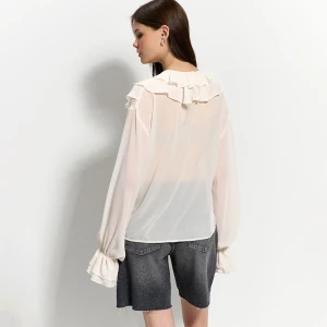 Kremowa bluzka z falbankami i wiązaniem House