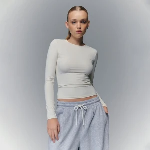 Kremowa koszulka z długim rękawem House