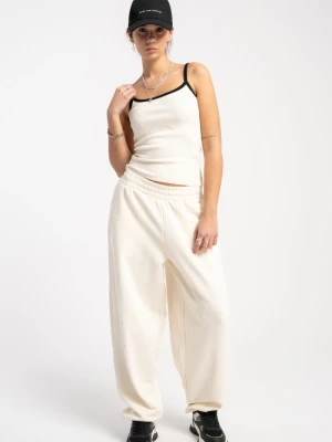 Kremowe spodnie dresowe gładkie o kroju BALLOON Reporter
